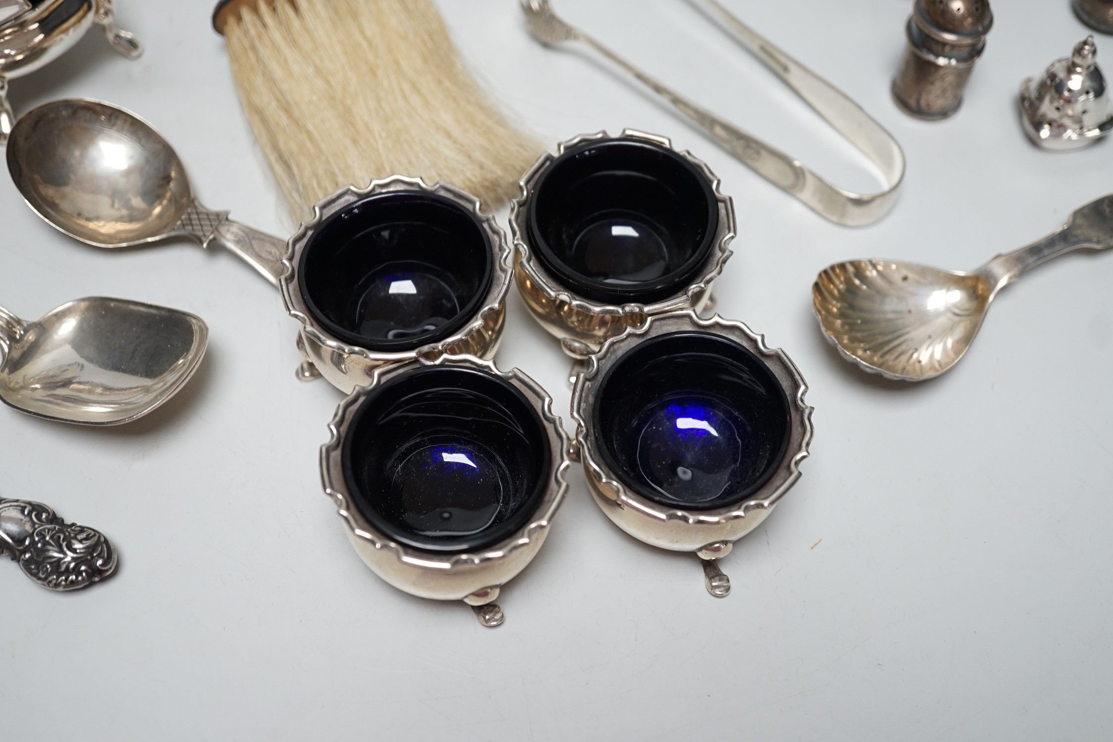 Sundry small silver including four salts by Mappin & Webb, three mounted dwarf candlesticks, two white metal Egyptian dishes and a white metal tazza, eight other items including two 19th century caddy spoons and four pla
